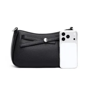 Detailed view of black leather shoulder bag with chic crossover accent for daily wear.