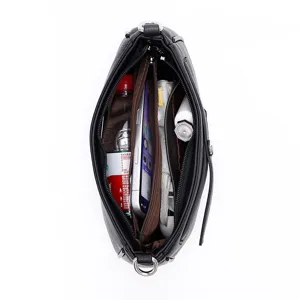 Crossbody bag interior detail showing multi-compartment storage capacity for daily essentials.