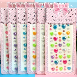 Close up of colorful heart crystal stickers pack, DIY acrylic gem sticker details for crafts.
