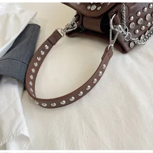 Brown litchi pattern leather bucket bag with metal studs, punk style shoulder crossbody bag.
