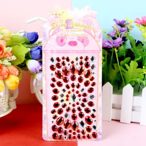 Detail view of sparkling red and clear rhinestone stickers, perfect for DIY phone and car dec.