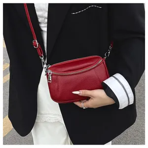 Red genuine leather crossbody bag for women, stylish mini shoulder bag with double zippers.