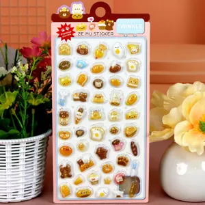 Close-up details of 3D embossed cute cartoon animal and food stickers on card display.