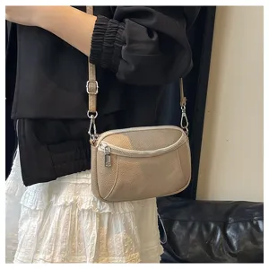 Genuine leather crossbody bag for women, stylish mini shoulder bag with secure double zippers.