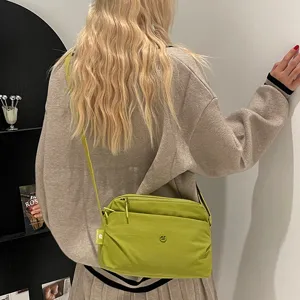 Casual multi-layer canvas crossbody bag for women, stylish daily green shoulder bag.