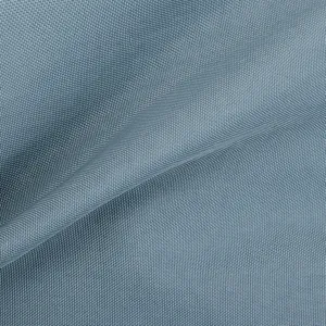 Gros plan détaillé du tissu en nylon haute densité déperlant avec une texture fine.