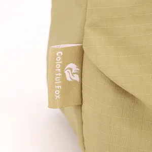 Detailed view of casual lightweight multi-layer crossbody canvas bag light green fabric