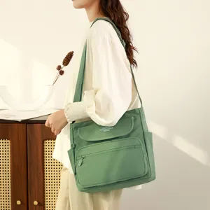 Stylish women's nylon crossbody shoulder bag with multiple multi-functional pockets for daily use.