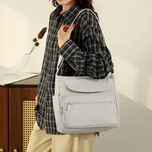 Casual nylon crossbody shoulder bag with multi pockets, stylish daily commute travel handbag.