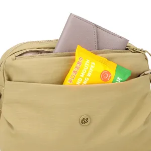 Casual multi-layer canvas crossbody bag for women, lightweight nylon shoulder bag.