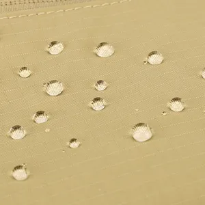 Close up detail view of waterproof fabric on casual shoulder bag with water droplets pattern