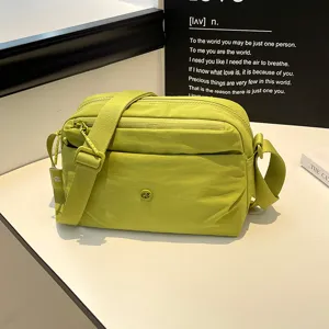 Casual lightweight multi-layer crossbody bag for women, versatile nylon shoulder bag detail.