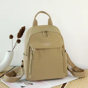 Zaino casual beige da donna in tessuto Oxford, grande capacità e stile da viaggio.