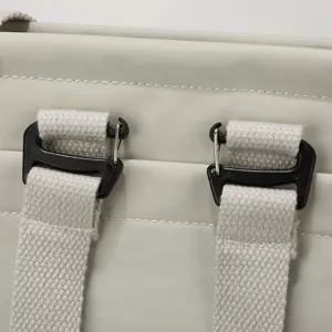 Lightweight laptop bag detail shot showing sturdy black hooks and durable gray nylon fabric texture.
