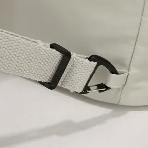 Detailed view of durable nylon laptop bag strap buckle and metal clip for secure daily use.