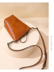 Stylish minimalist brown leather crossbody shoulder bag for women, perfect for daily casual wear.