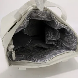 Interior detail of lightweight waterproof nylon laptop tote bag with organized compartments.