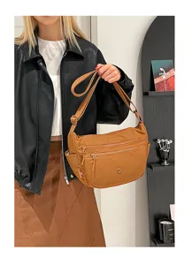 Casual nylon crossbody bag detail showcasing multi-compartment design and durable fabric.