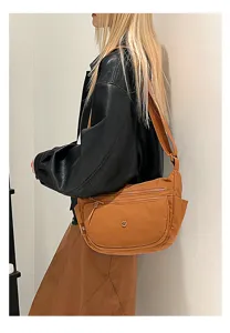 Casual nylon crossbody bag for women, lightweight multi-compartment shoulder bag.