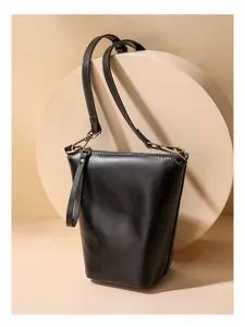 Minimalist black leather shoulder bag for women, stylish crossbody bag with metal hardware.