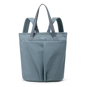 Lightweight waterproof nylon laptop backpack and tote bag for daily work and school use.