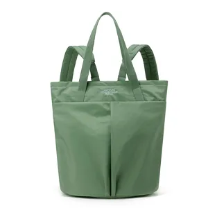 Lightweight waterproof nylon convertible backpack tote bag for daily work and laptop carrying.