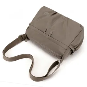 Detailed view of women casual nylon crossbody bag, waterproof fabric with durable shoulder strap.