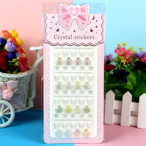Detail shot of colorful acrylic crystal diamond stickers with cute hearts, shells and fish tails.