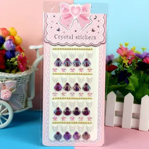 Crystal sticker detail showing pearlized sea shell and star gems for DIY children crafts.