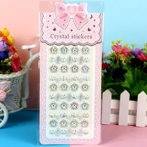 Close up of colorful acrylic crystal rhinestone stickers for DIY crafts and children decoration.