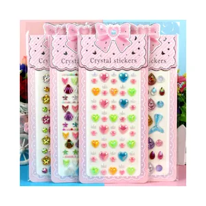 Colorful DIY acrylic crystal rhinestone stickers with cute heart and mermaid tail designs.