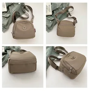 Detail view of lightweight nylon crossbody bag, casual shell shoulder bag with adjustable strap.