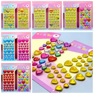Children laser bubble stickers detail view showing colorful emoji and heart puffy sticker sheets.