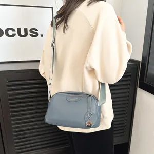 Genuine leather crossbody bag for women, stylish casual shoulder bag with wide strap detail.