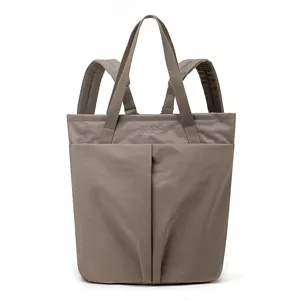 Waterproof nylon laptop backpack and tote bag with dual straps and spacious front pocket style.