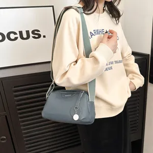 Genuine leather crossbody shoulder bag for women, stylish wide strap casual hobo handbag.