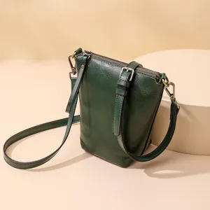 Dark green leather cross-body shoulder bag for women, simple design daily handbag main view.