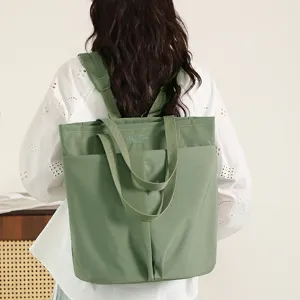 Lightweight waterproof nylon convertible laptop backpack tote bag for daily work.