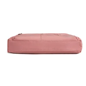 Pink nylon crossbody bag side view detail, casual daily shoulder handbag for women.