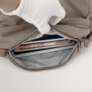 Women nylon crossbody shoulder bag interior detail showing large capacity and pockets.
