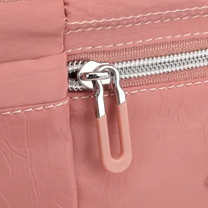 Nylon crossbody bag detail zipper texture close up view waterproof fabric elegant accessory