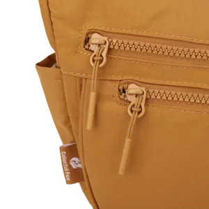 Close-up detail of durable nylon crossbody bag with double zippers and functional side pocket.