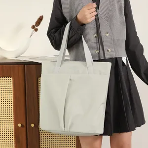 Light gray nylon laptop tote bag for women, lightweight work shoulder bag with dual top handles.
