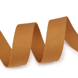 Durable nylon webbing strap detail in a warm caramel brown tone, smooth and strong texture.