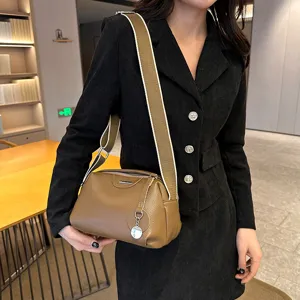 Genuine leather shoulder bag for women with wide strap, stylish casual crossbody purse.