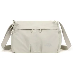 Water-resistant nylon crossbody bag for women, casual daily shoulder handbag with multi pockets.