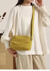 Stylish women's nylon crossbody bag, casual minimalist shoulder bag for summer everyday use.