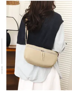Beige nylon crossbody bag casual crescent shoulder bag for daily travel and commuter use