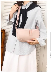 Casual minimalist nylon crossbody bag for women, lightweight waterproof crescent saddle bag pink