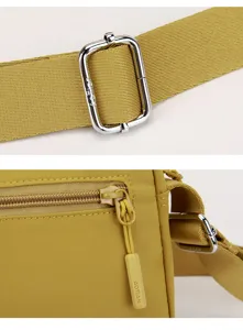Women's casual nylon crossbody bag detail view with metal buckle and zipper puller